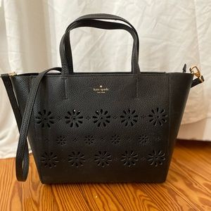 Kate Spade black tote bag with floral cutouts